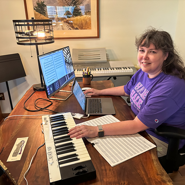 Laurel Littrell, associate dean at K-State Libraries, is working on a new piece of music for the centennial celebration of Farrell Library in her home studio.