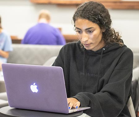 Student using the laptop.